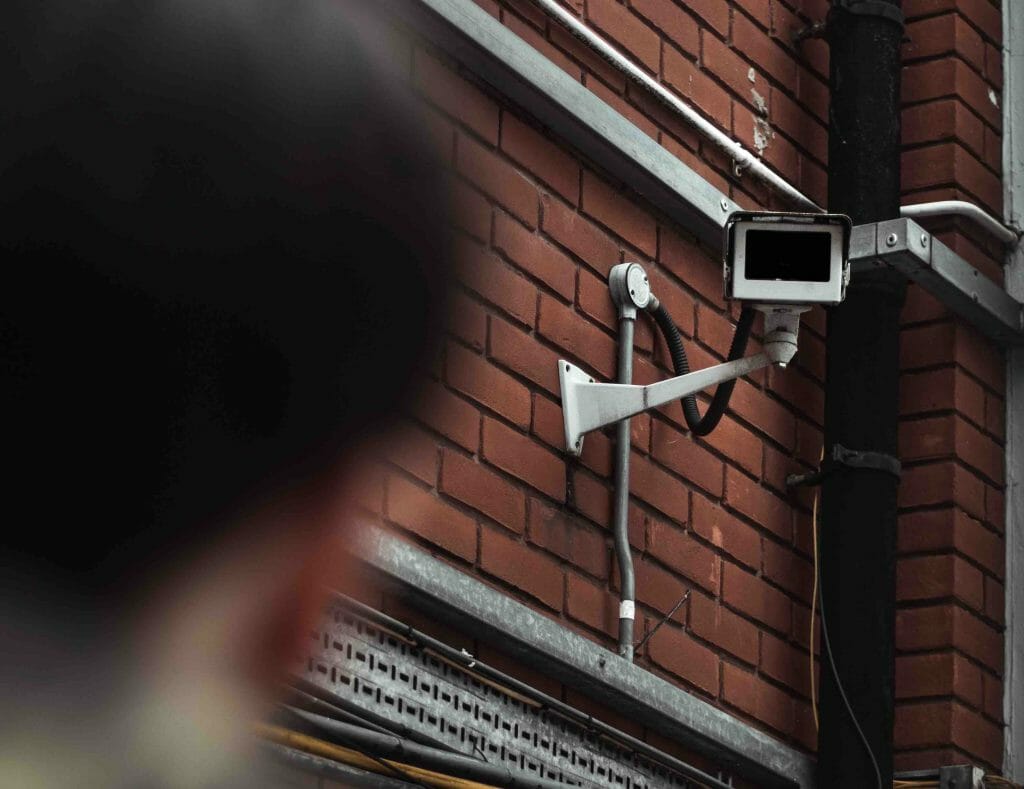 cctv camera mounted on brick wall