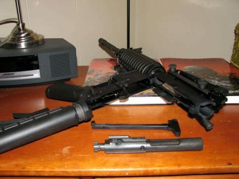 a disassembled riffle for cleaning