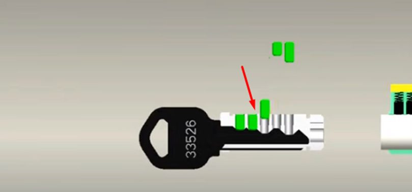 sliding out the bottom pins from the cylinder plug