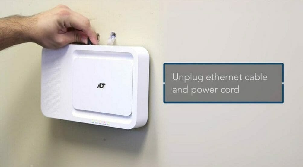 man turning off the ADT device