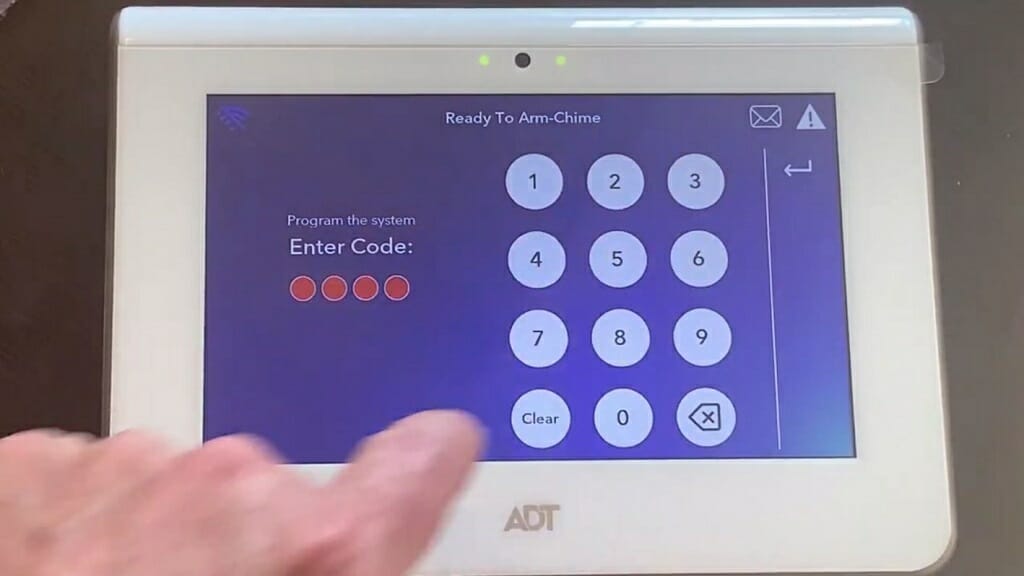 man entering ADT's code