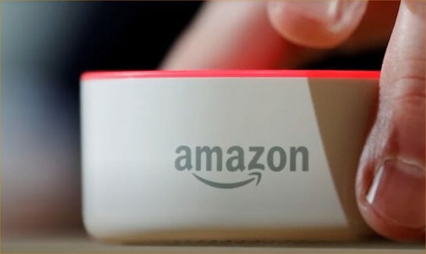 hands holding amazon alexa device
