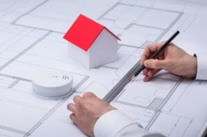 Architecture Drawing Blueprint Near Smoke Detector And House Model house on paper