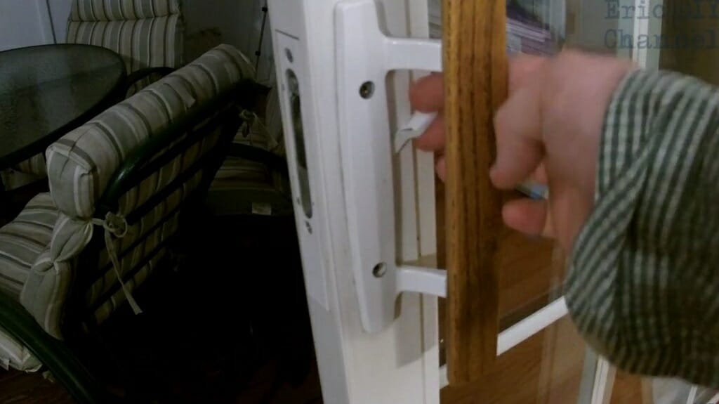 hand holding sliding door handle