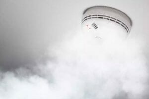 Smoke detector of fire alarm in action smoke detector with smoke