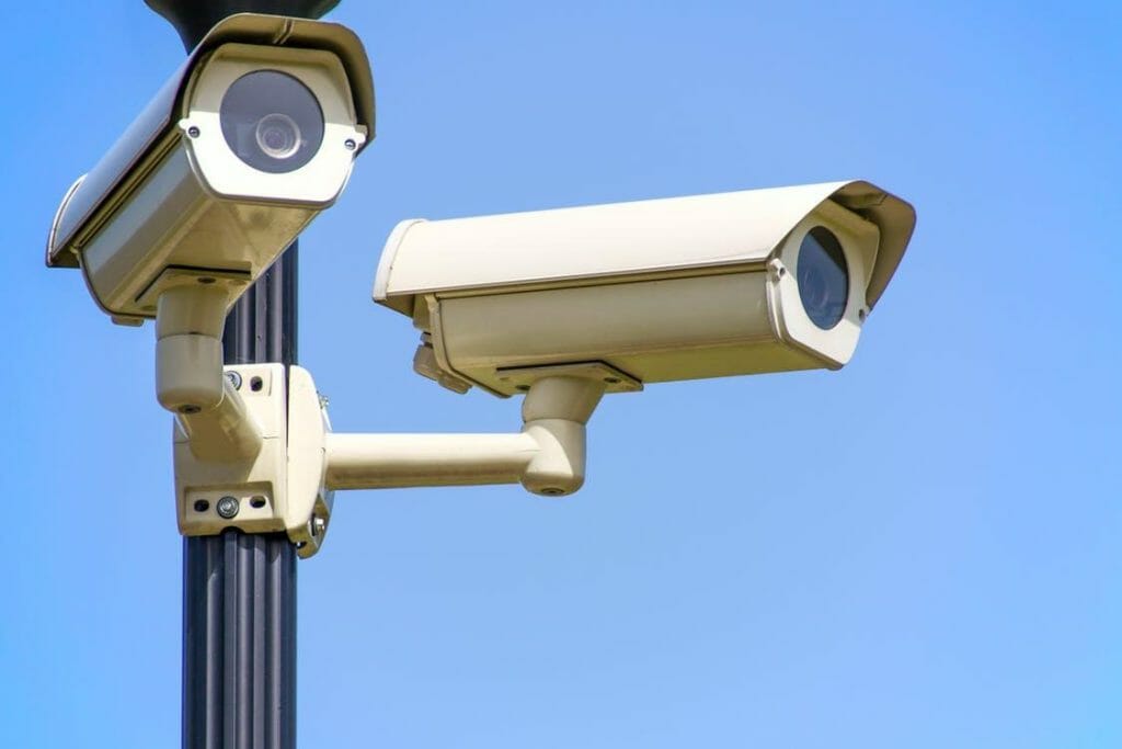 two security camera in a pole