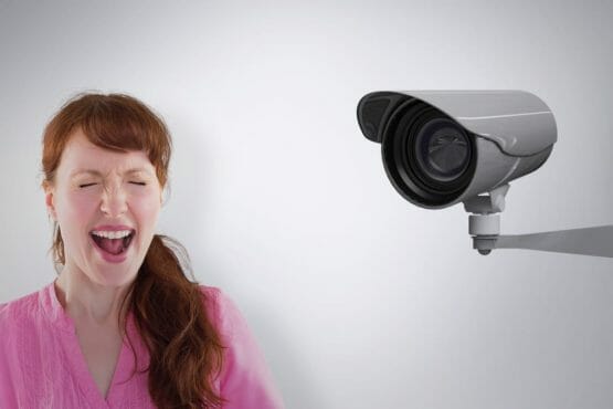 Woman Shouting Towards The Camera Against Cctv Camera