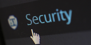 a pointer finger cursor pointing to the word Security